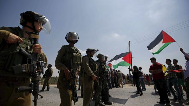 Israeli security forces face off against Palestinian protesters at a demonstration outside Ramallah, on Sept. 4, 2015.Reuters 